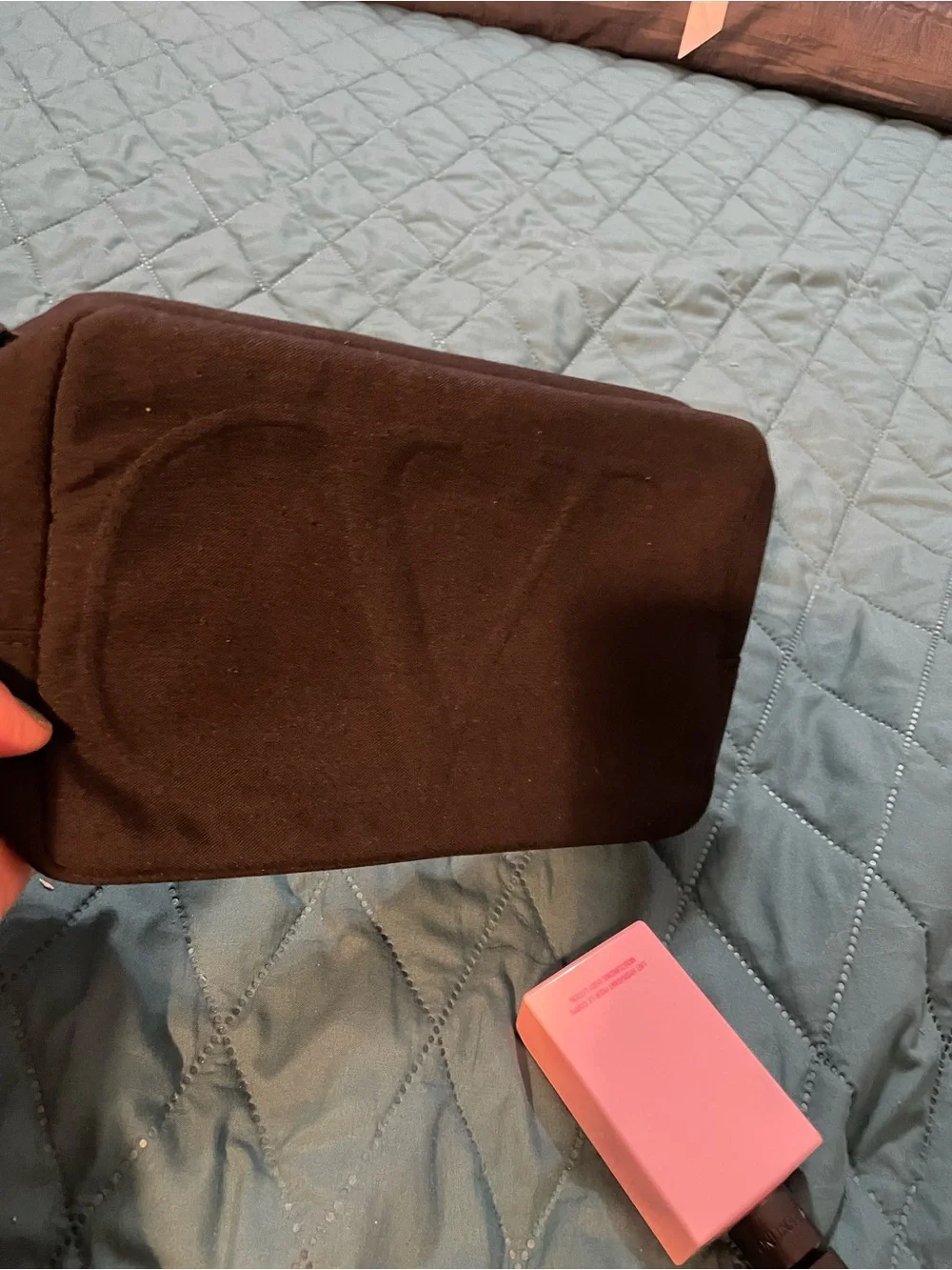 Valentino Black Travel Cosmetic Pouch with Wrist Strap with perfumed lotion
